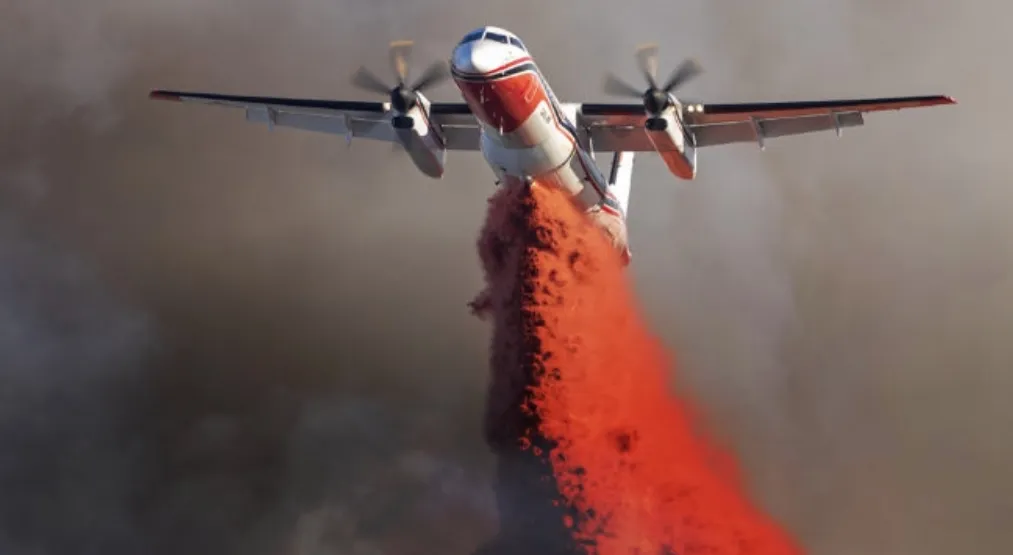 plane spraying red stuff